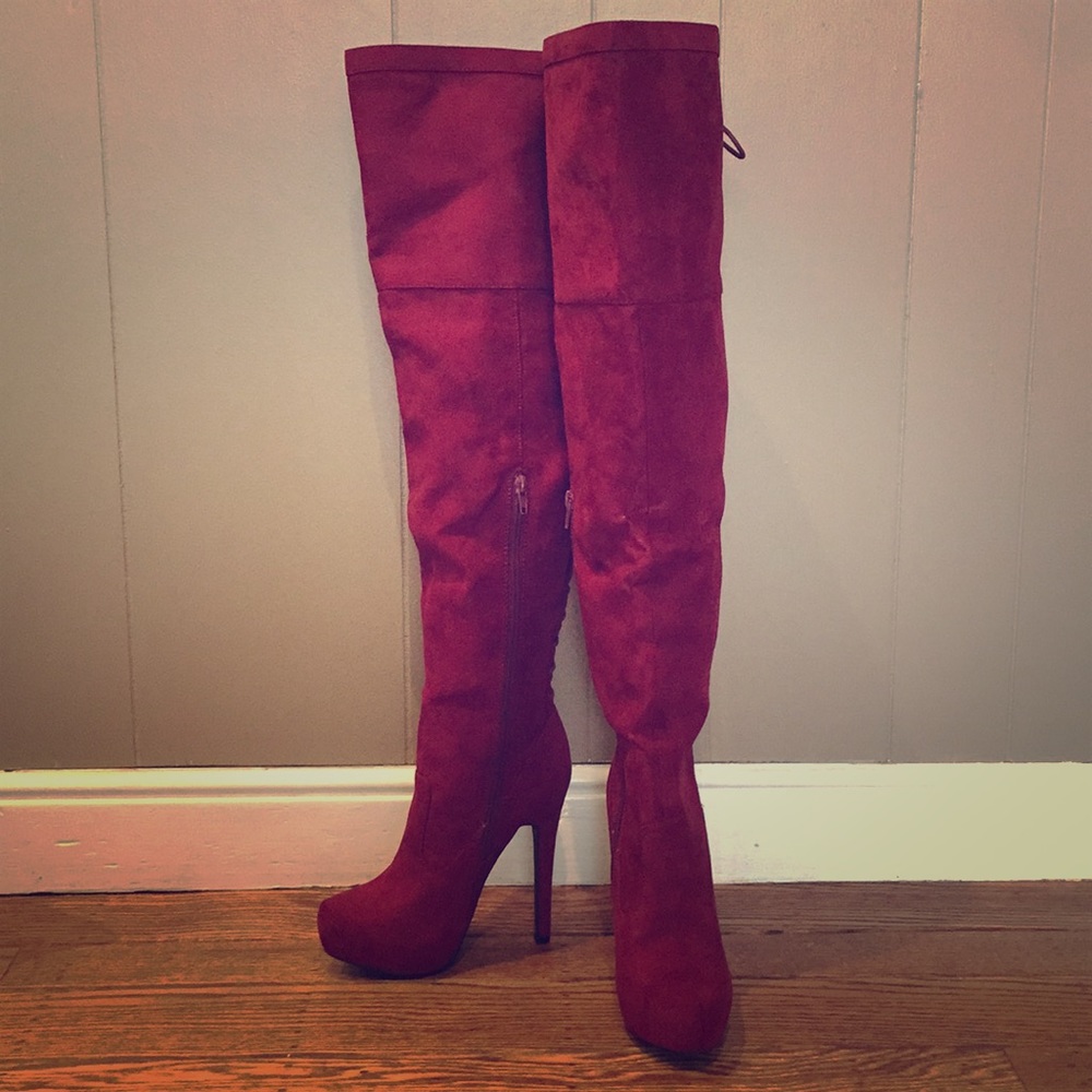 Red leather like thigh high boots